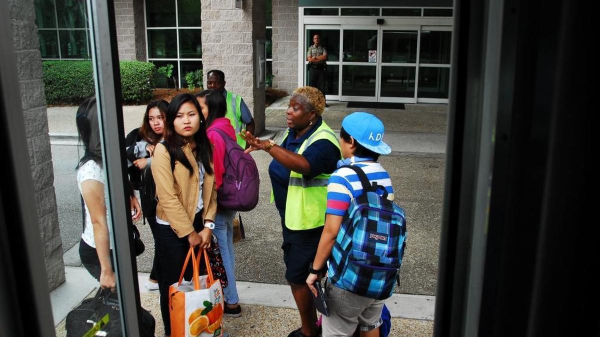 A Palmetto Breeze employee explains the evacuation process to a group of interns who were living at Hilton Head Resort.