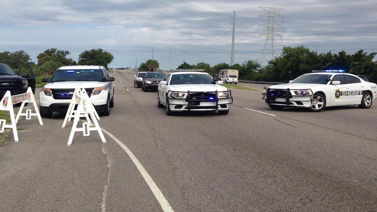 Beaufort County Sheriff’s Office patrol cars line up early Saturday morning as the evacuation of Hilton Head Island began along U.S. 278.
