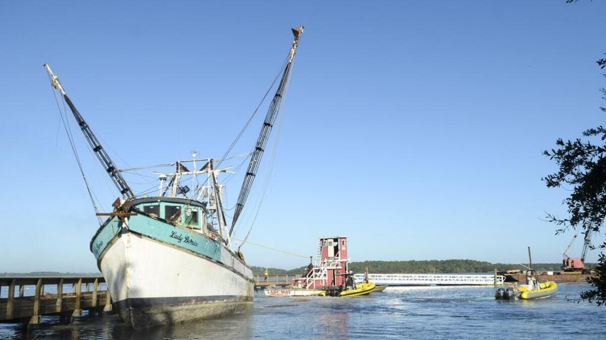 It took three tow boats working in concert to refloat the shrimp boat Lady Bernice after it was driven aground by Hurricane Matthew.