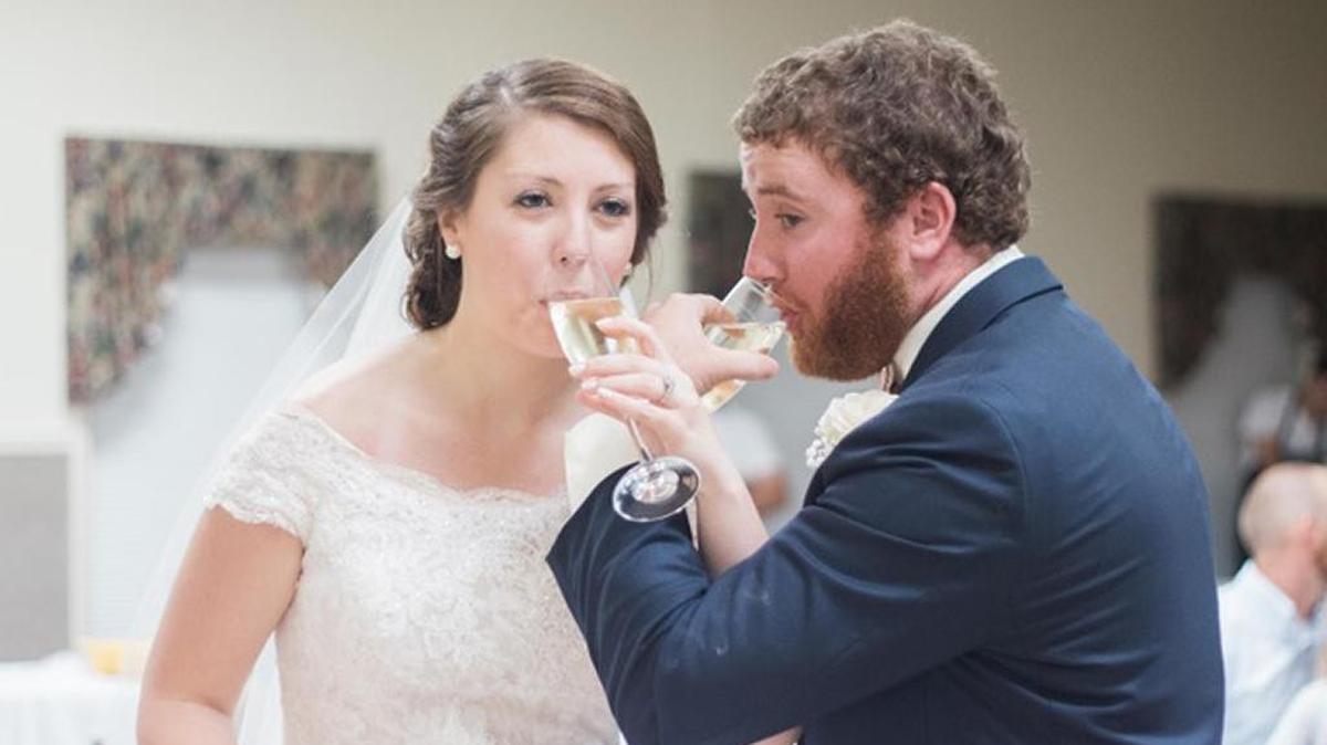 Jason Davis and his bride, Caitlyn Sloss, on their wedding day, which was delayed because of his duties as a Palmetto Electric Cooperative lineman in the aftermath of Hurricane Matthew.