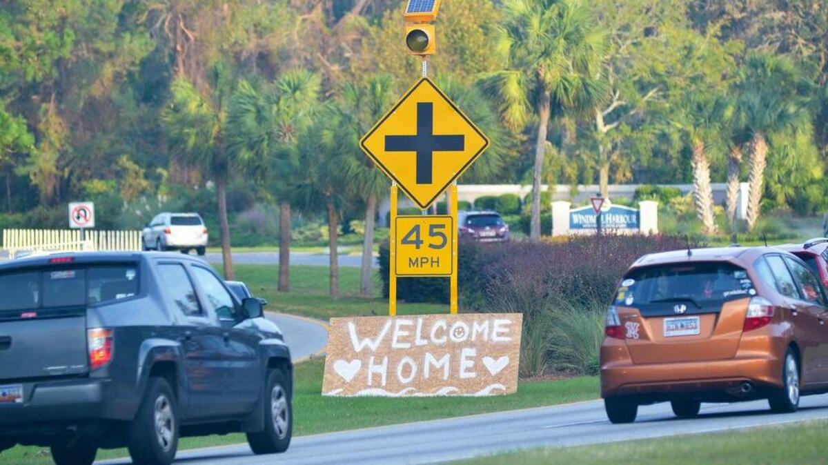 Island-bound traffic rolls past Byron Sewell’s hand-made welcome sign that he put up on Oct. 11 to welcome back all the islanders returning from the Hurricane Matthew evacuation.