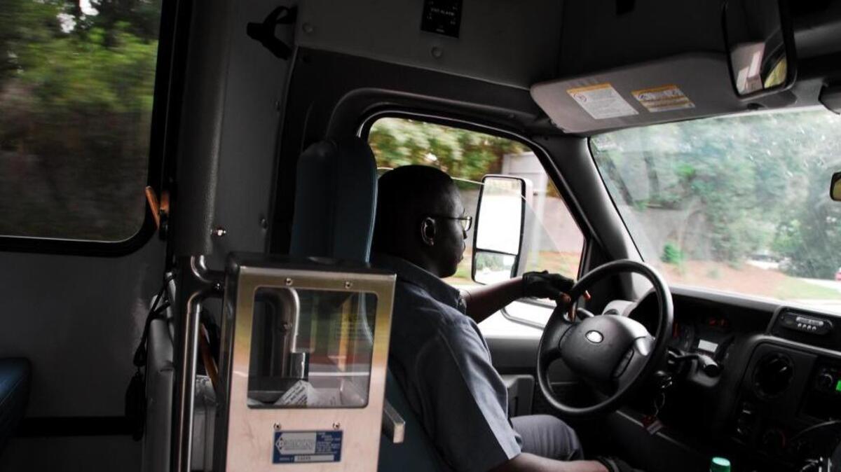 Tyrone Drayton, a 10-year Palmetto Breeze driver, transports people to the Hilton Head Island Airport for evacuation on Wednesday, Oct. 5, 2016.