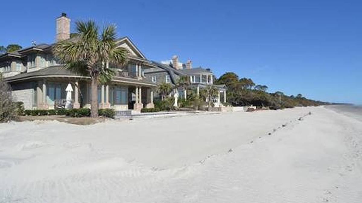About 15 yards of sand pushed up by bulldozers as a temporary repair is all that separates these oceanfront homes on Piping Plover in Sea Pines — photographed on Jan. 11, 2017 — from the waves at high tide. This stretch of South Beach was washed away by Hurricane Matthew.