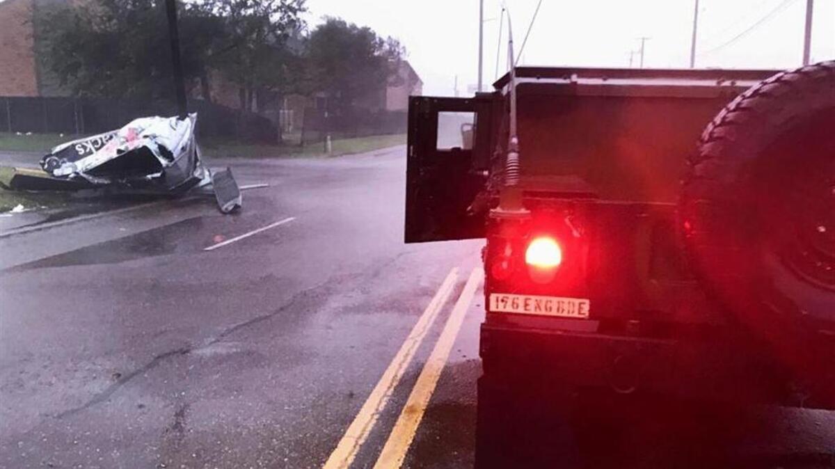 Texas Army National Guardsmen find street debris in Victoria, Texas, Aug. 26, caused by Hurricane Harvey.