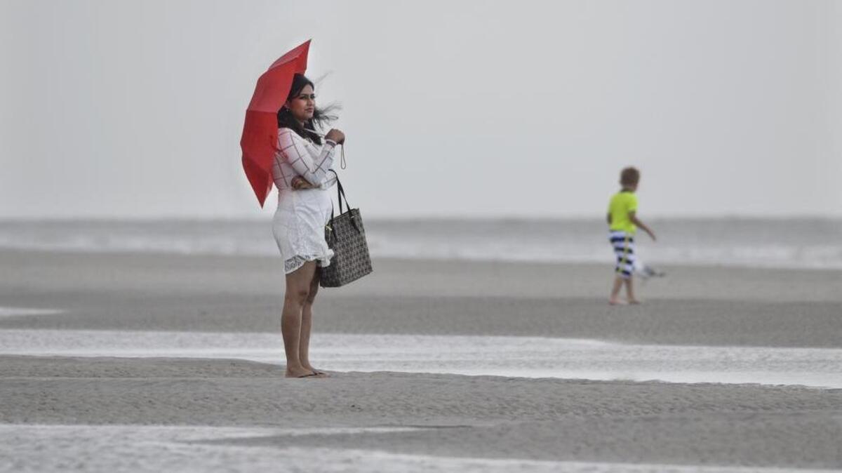 "We just came yesterday for Memorial Day weekend, but it's raining and raining," said Tahiya Ismat, visiting from Virginia, as she scanned the horizon in search of any sign of sunshine as a light rain fell on Hilton Head's Coligny Beach. Though Tropical Storm Bonnie seemed to have passed without causing any significant flooding or wind damage, it left behind a dreary Sunday with sporadic rain showers.