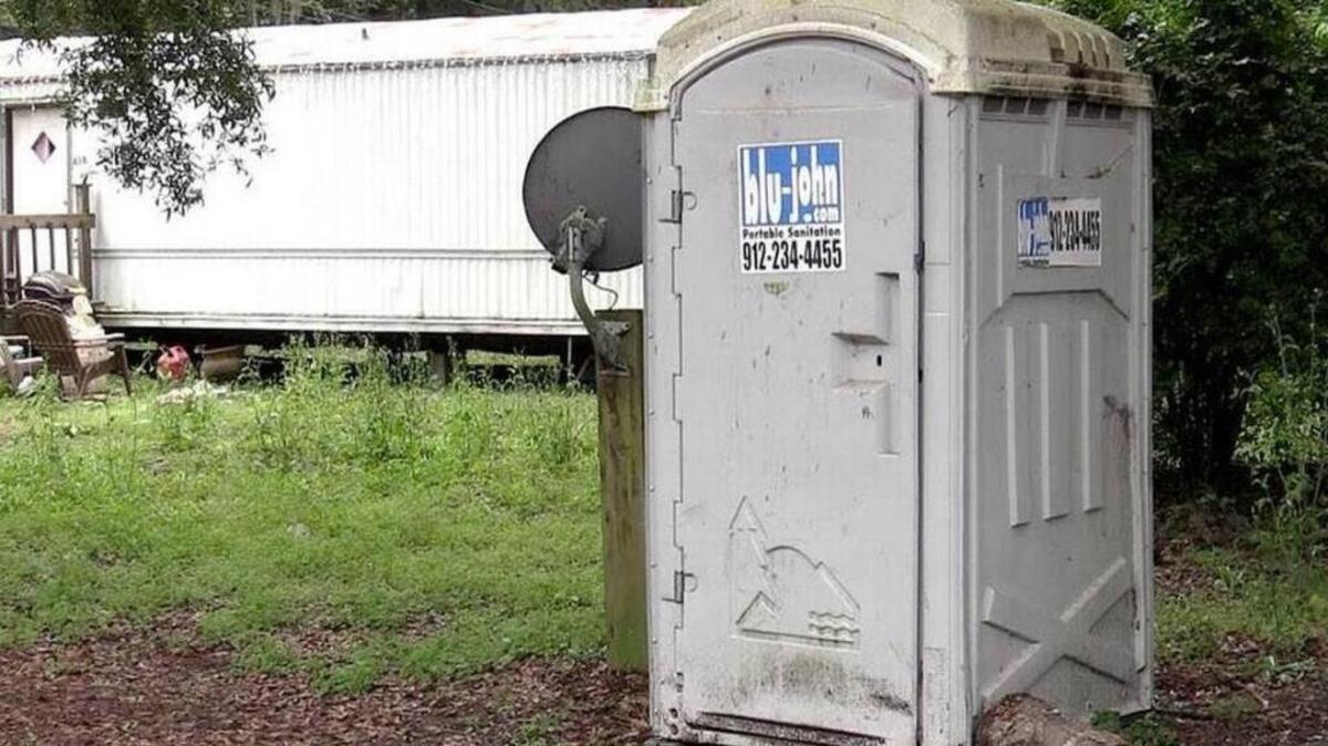 As this 2015 photo shows, some residents on Sam Frazier Retreat have resorted to using portable toilets to avoid problems with septic tanks that overflow.