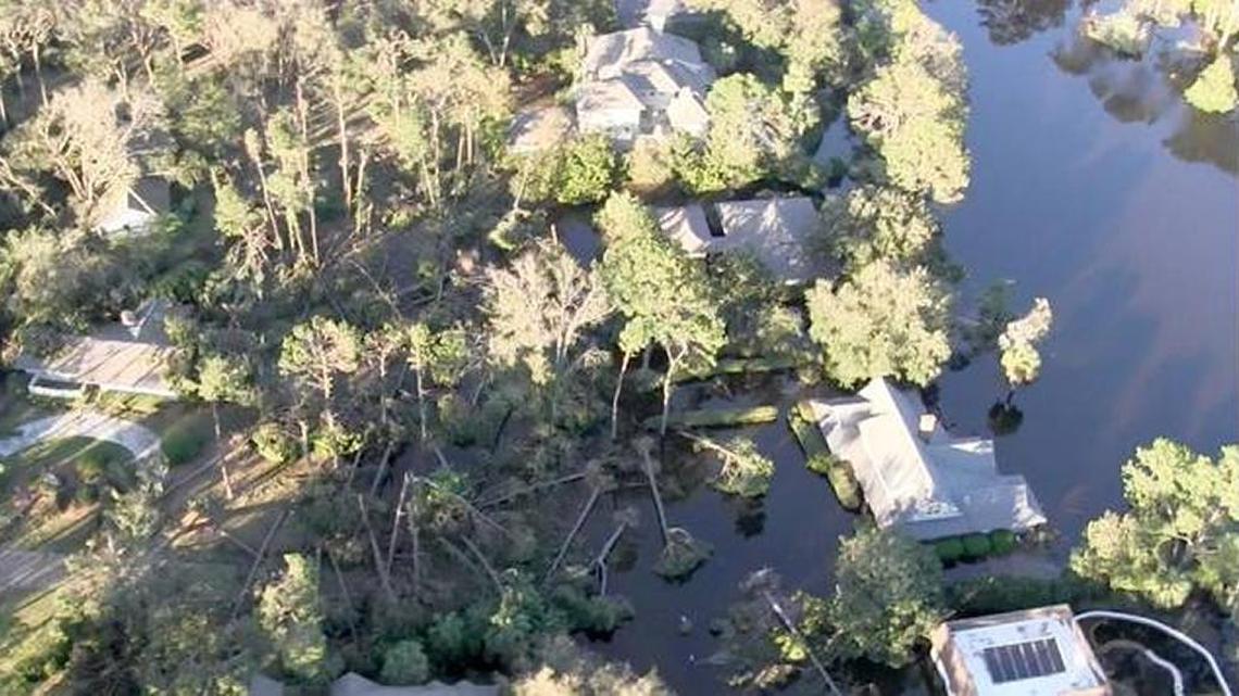 This screenshot is taken from a video filmed from a U.S. Coast Guard helicopter that shows fallen trees and standing water a day after Hurricane Matthew roared past Hilton Head Island in October.
