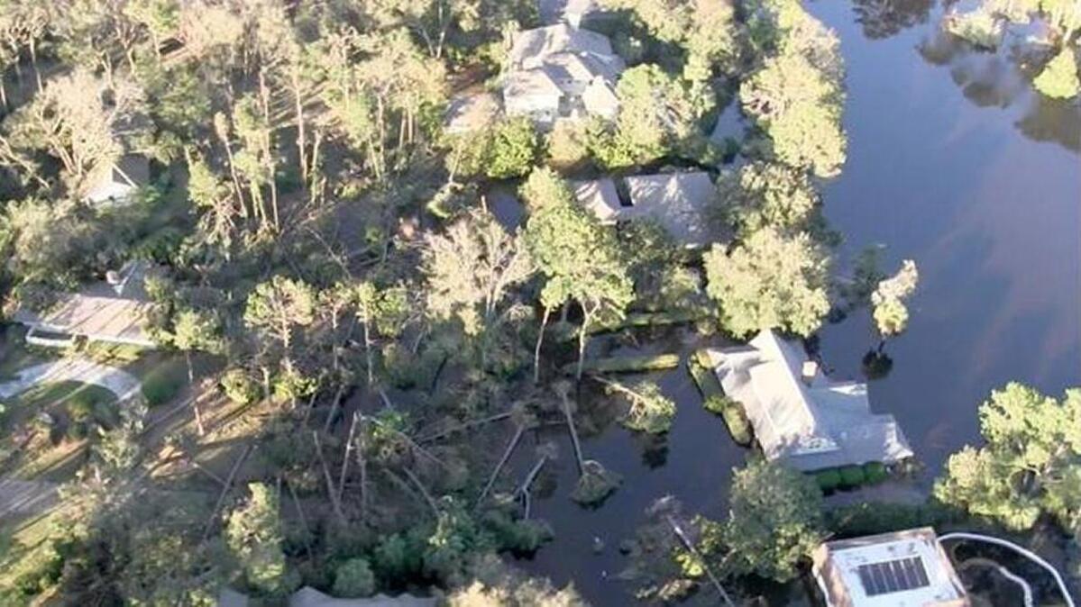 This screenshot is taken from a video filmed from a U.S. Coast Guard helicopter that shows fallen trees and standing water a day after Hurricane Matthew roared past Hilton Head Island in October.