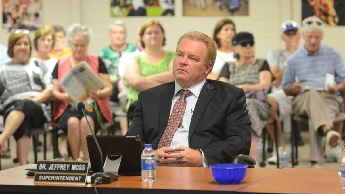 Superintendent Jeffrey Moss listens to a speaker during the public comment portion of a special Beaufort County School Board meeting Sept. 21, 2015, held to discuss issues surrounding the hiring of Moss’ wife to an administrative position with the district.