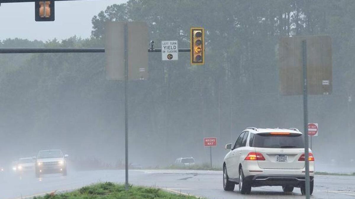 While the yellow turn signal flashes Thursday, a driver waits for a break in oncoming traffic to turn left from westbound U.S. 278 onto Buck Island Road in Bluffton. A three-vehicle crash there Tuesday killed a pregnant teacher and her unborn child.