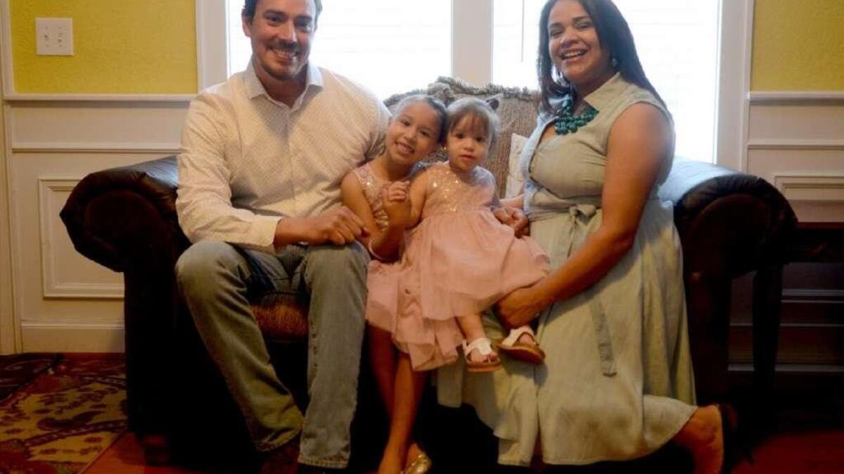 Census shows the new face of Bluffton. Mario and Maria Cordero, of Bluffton, stand for a portrait with their daughters Samantha, 6, and Sarah, 1, in front of their home on Wednesday, March 30, 2016 in Bluffton.