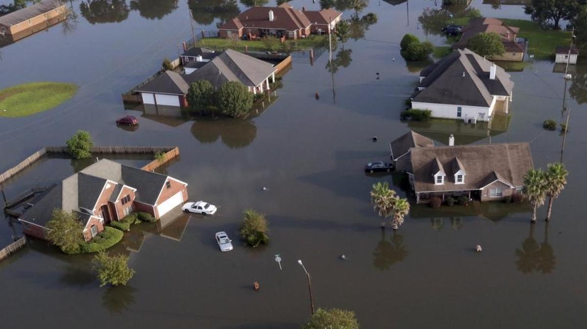 Homes sit in floodwaters caused Harvey in Port Arthur, Texas, on Friday, Sept. 1, 2017.