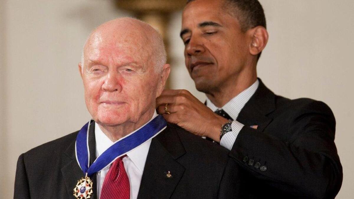 John Glenn receives the Presidential Medal of Freedom, the nation’s highest civilian honor, from President Barack Obama at the White House on May 29, 2012.