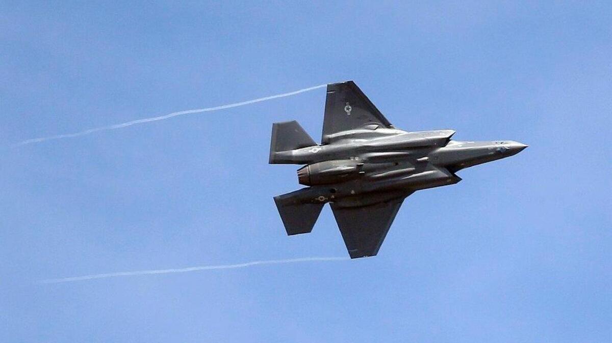 In this Wednesday, Sept. 2, 2015, file photo, an F-35 jet arrives at its new operational base at Hill Air Force Base, in northern Utah. Shares of Lockheed Martin fell Monday, Dec. 12, 2016, as President-elect Donald Trump tweeted that making F-35 fighter planes is too costly and that he will cut “billions” in costs for military purchases.