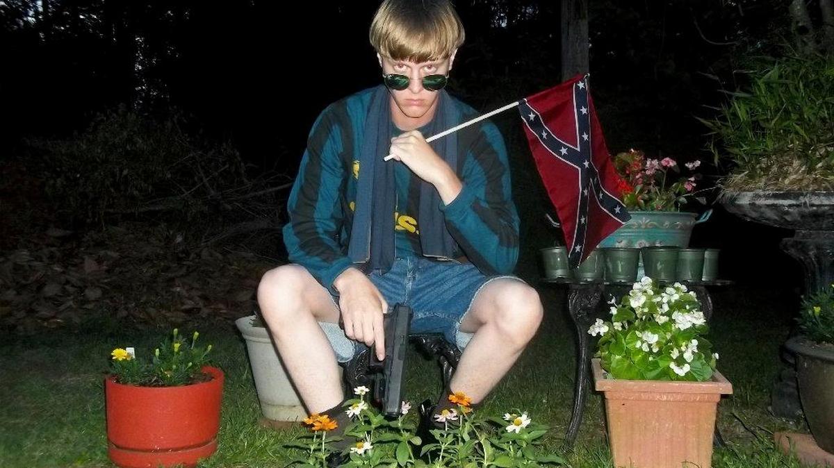 This undated photo that appeared on Lastrhodesian.com, a website investigated by the FBI in connection with Dylann Roof, shows him posing for a photo holding a Confederate flag.