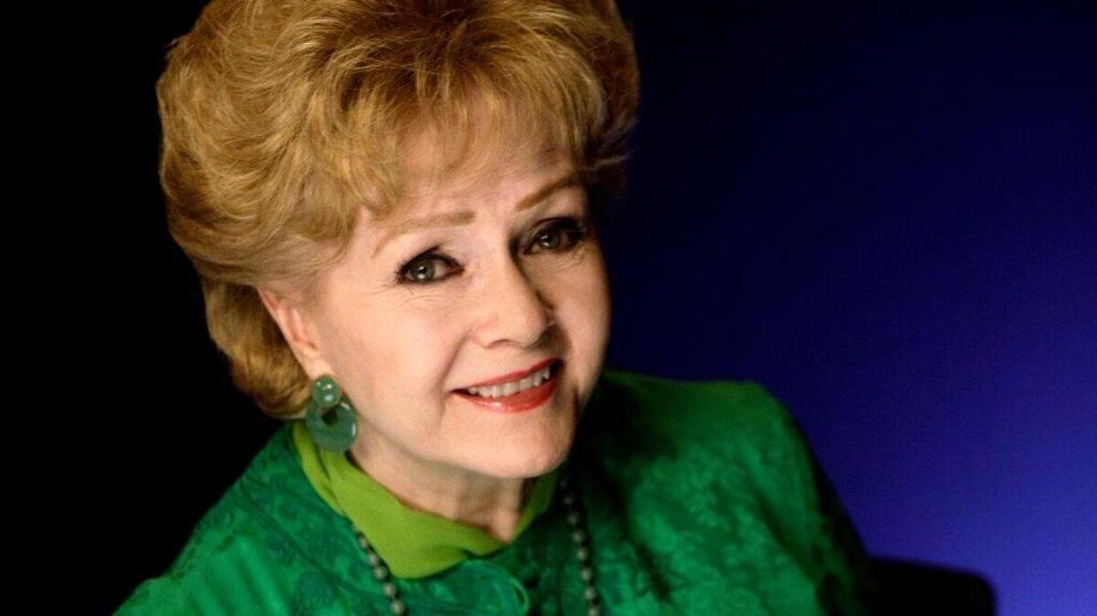 This Oct. 14, 2011 file photo shows actress Debbie Reynolds posing for a portrait in New York.