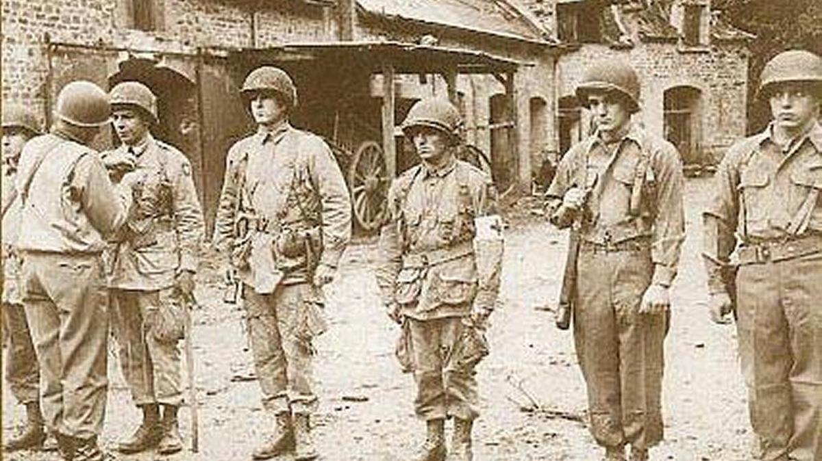 U.S. Army Lt. Col. Benjamin H. Vandervoort is among those being decorated by Lt. Gen. Omar N. Bradley.