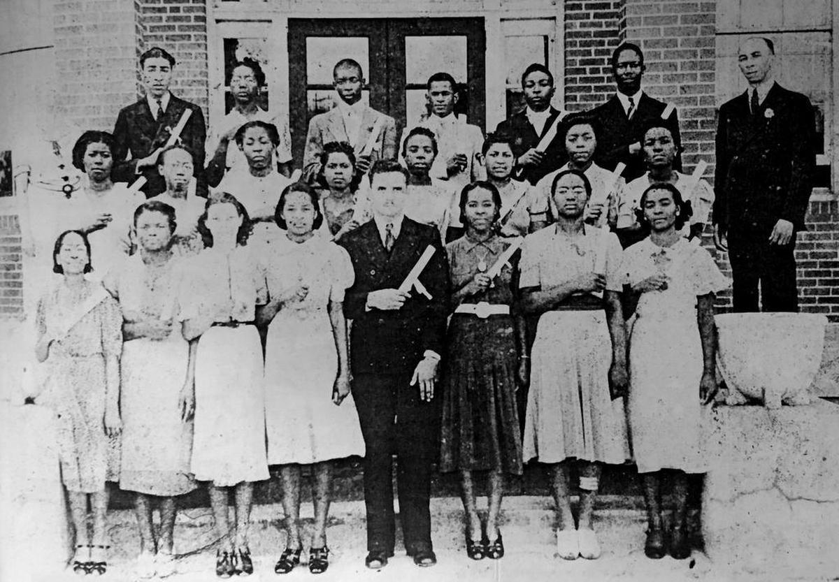 First graduating class of Robert Smalls High School under the leadership of W. Kent Alston, back right, principal in 1939.