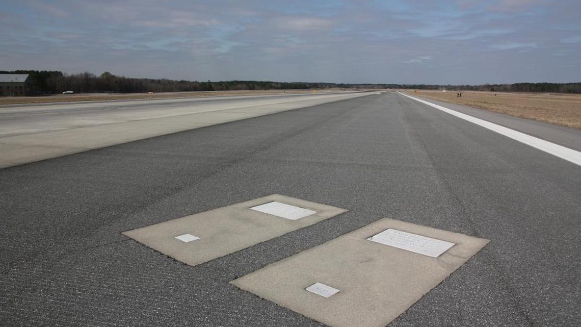Richard Dotson, along with his wife Catherine, gravesite markers are located at the Savannah/Hilton Head International Airport near the shoulder of a runway.