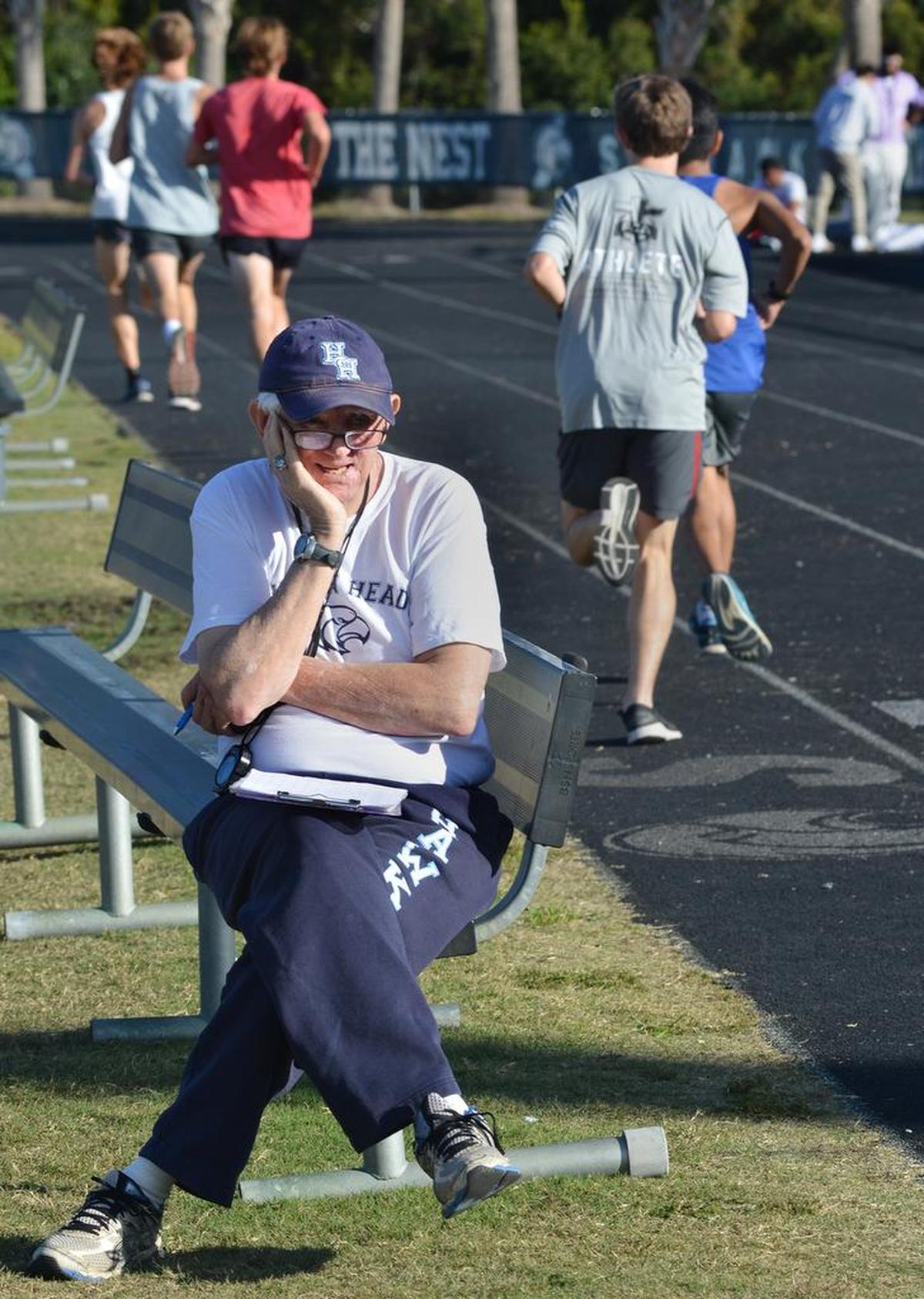 Hilton Head Island High School cross country coach Bill Wrightson watches as his squad practices in 2017.