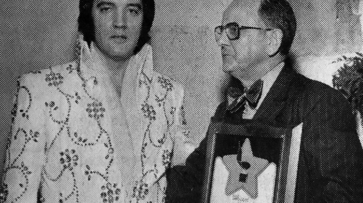 In this submitted photo, Hilton Head Island resident John Sippel presents a Billboard Trendsetter Award to Elvis Presley in 1975 in Las Vegas.