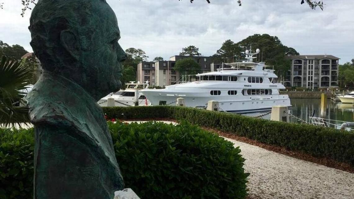 The bust of Sea Pines founder Charles E. Fraser at his grave by the Liberty Oak in Harbour Town, along a walkway of coquina shell.