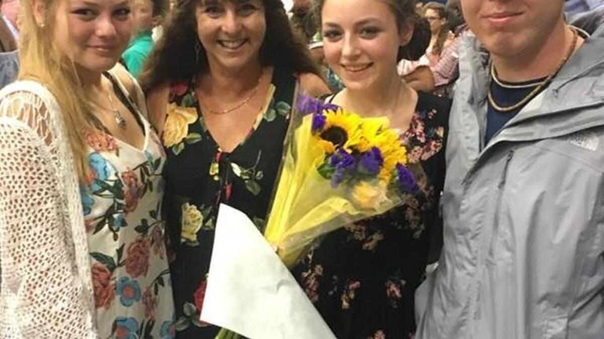 Rebecca Martel with her children, from left, Lara, Faith and Mason on May 24, 2017, at Faith’s eighth-grade graduation ceremony.