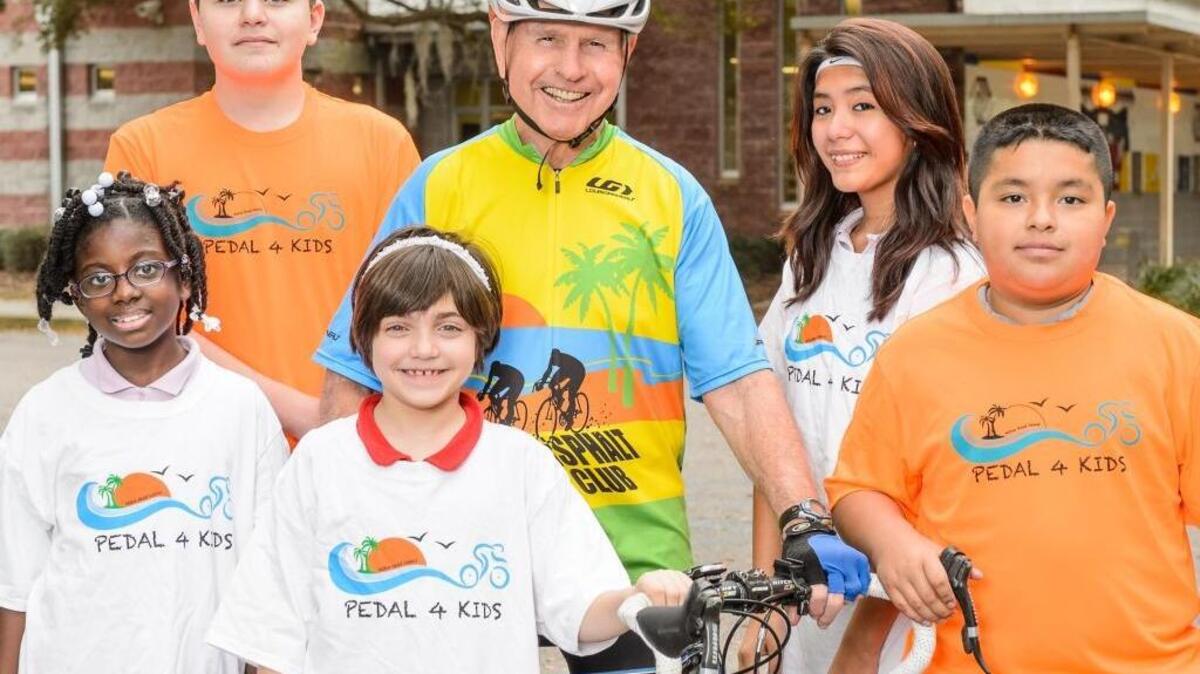 Gen. Art Brown poses with children of the Boys and Girls Club of Hilton Head, the beneficiary of the Pedal4Kids community bike ride on Saturday, Sept. 24, 2016.