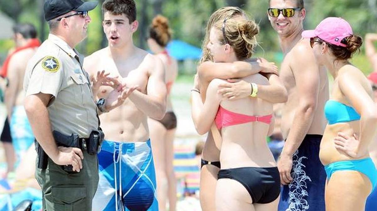 A sheriff’s deputy talks to some young beachgoers on Memorial Day weekend 2012 while patrolling the very busy Coligny Beach area on Hilton Head Island. The Beaufort County Sheriff’s Office said it was prepared for the invasion of college students, stepping up what is calls “proactive patrols,” where it tries to keep kids out of trouble with warnings.