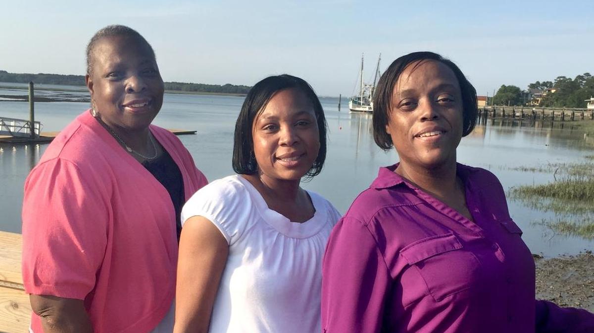 From left, Celesta Johnson, Veronica Young and Tonya Miller pose on the dock at the Town of Hilton Head Island’s Rowing and Sailing Center at Squire Pope Community Park.