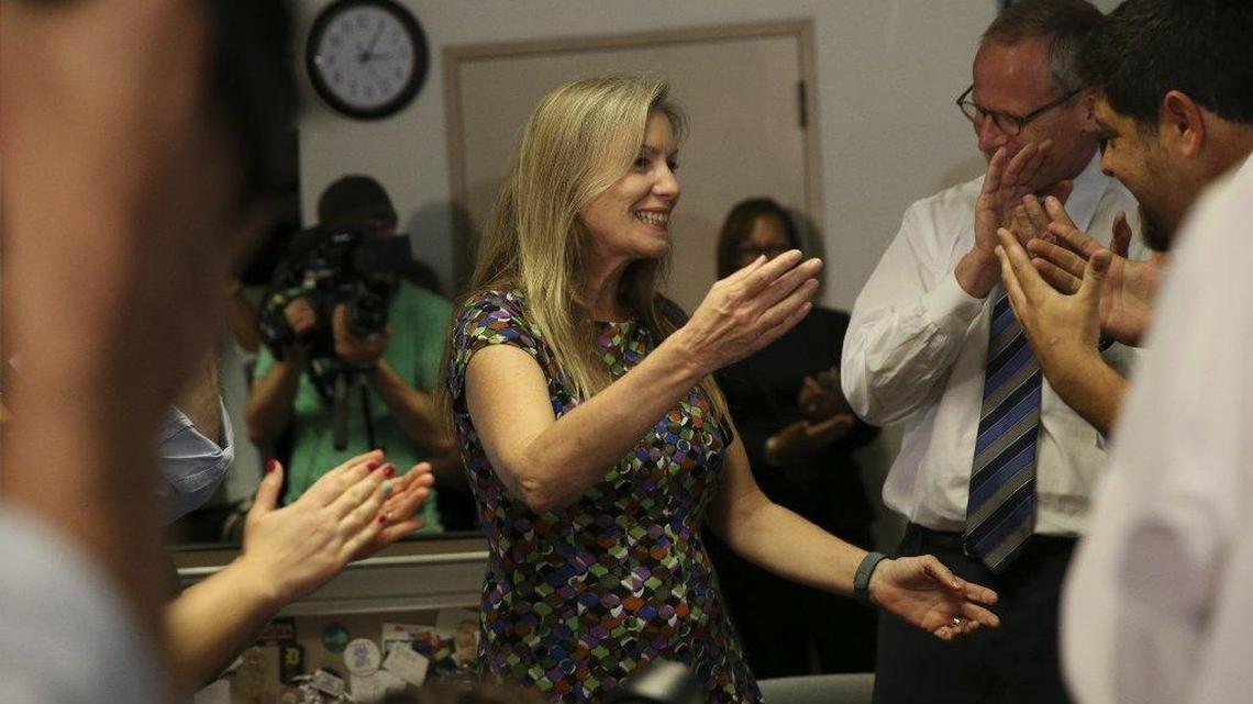 Tampa Bay Times reporter Leonora LaPeter Anton and Times Chairman and CEO Paul Tash celebrate winning two Pulitzer prizes, in the Times’ newsroom in St. Petersburg, Fla., Monday, April 18, 2016. The Times won Pulitzer prizes for investigative reporting and local reporting.