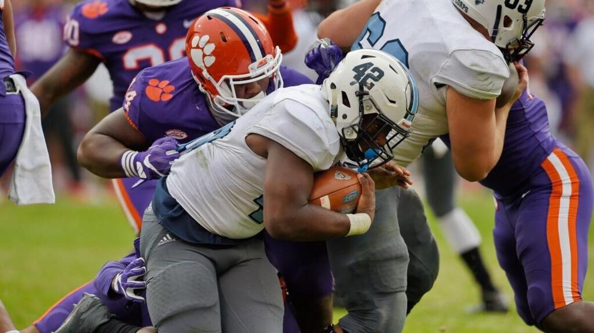 Clemson’s Nyles Pinckney tackles Citadel’s Brandon Berry for a loss during the second half of an NCAA college football game Saturday, Nov. 18, 2017, in Clemson. Clemson won 61-3.