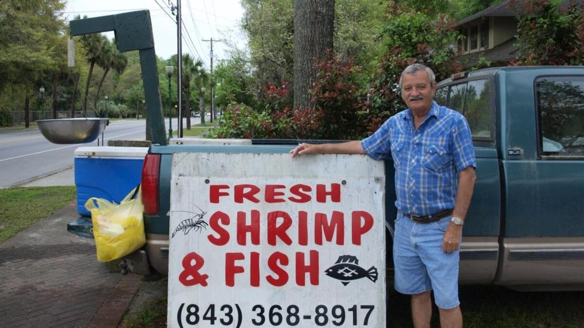 Mack Lowther sells seafood by his daughter’s beauty shop in Ridgeland.