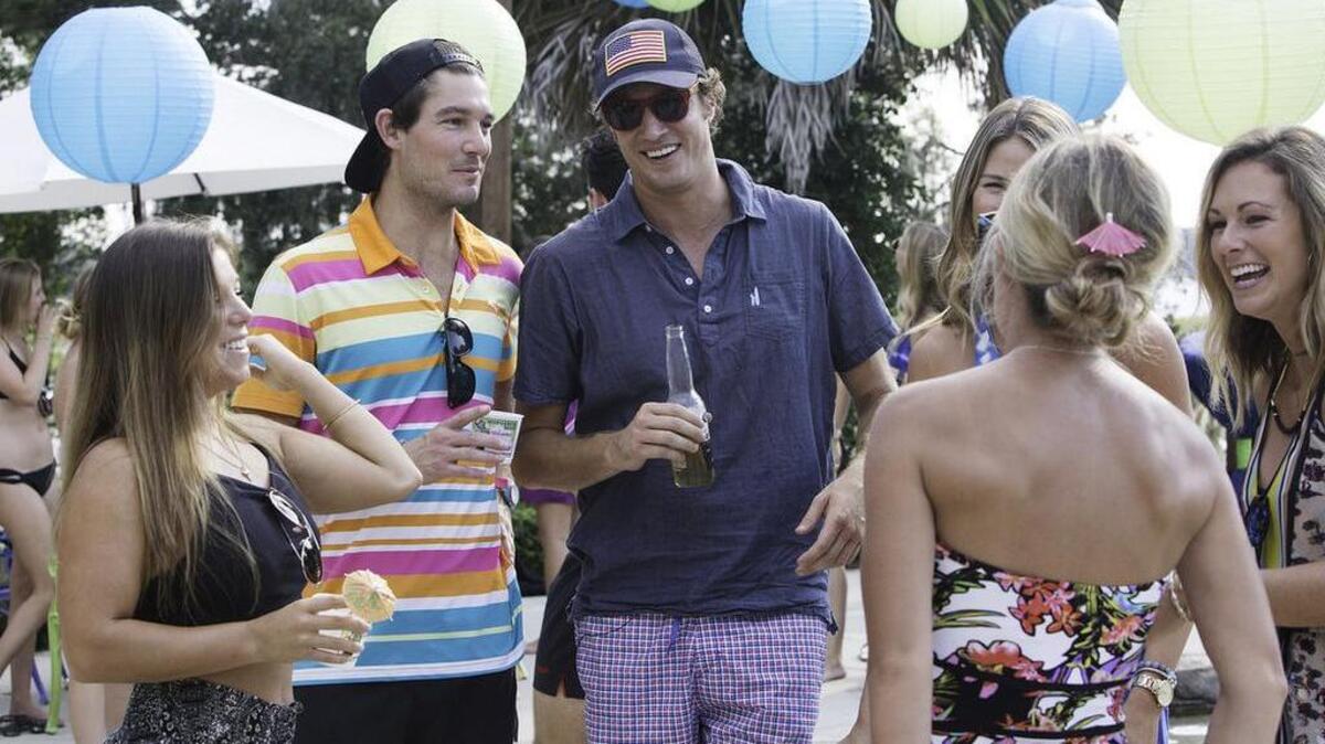Craig Conover, left, and Shep Rose appear in a scene from season four of “Southern Charm.”