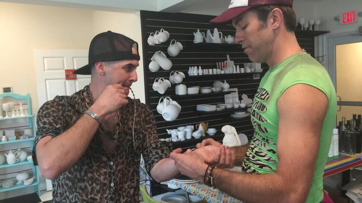 Andy Pitts, aka Billy C., gets some help with his accessories from Jevon Daly, aka Taime Downz, before Silicone Sister’s post-St. Patrick’s Day parade show March 13 at Bomboras Grille on Hilton Head Island.