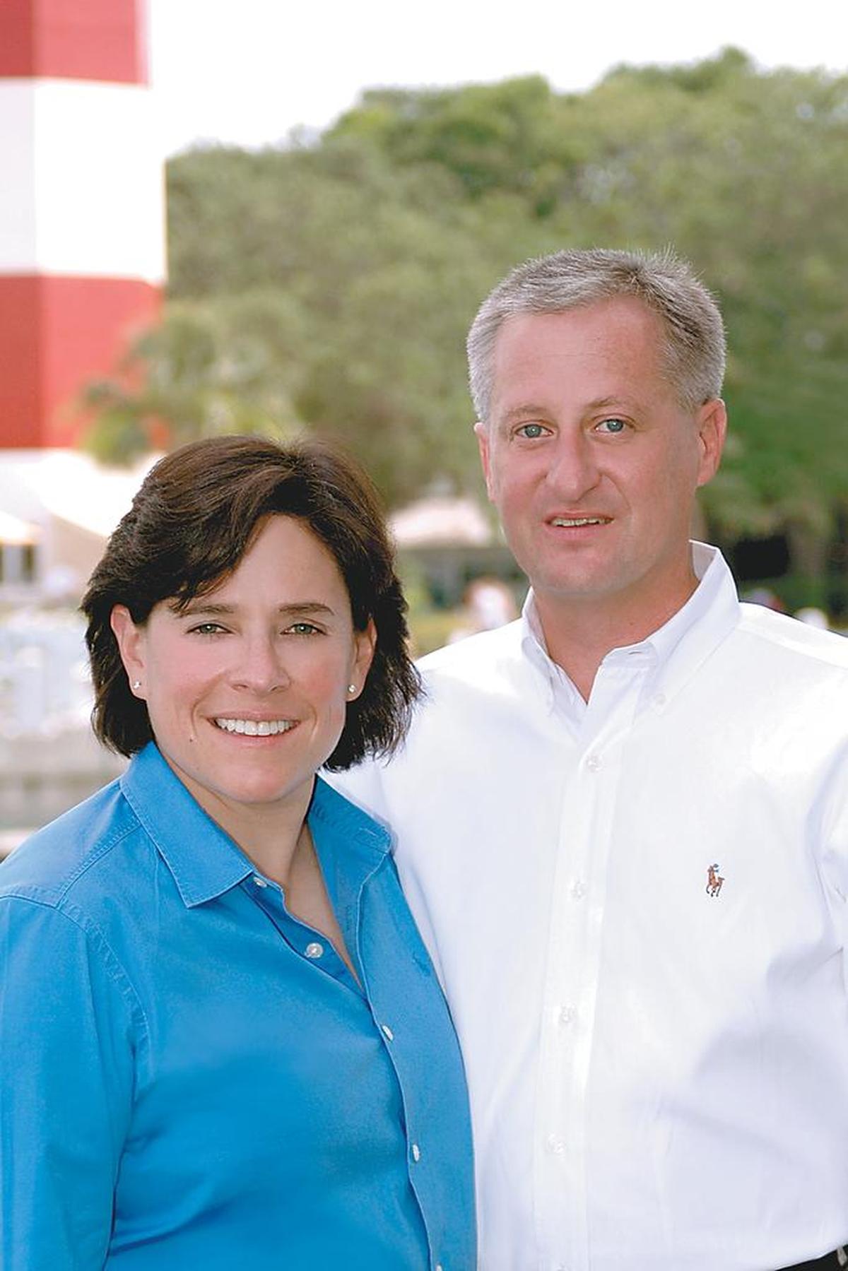 Elizabeth and John Calvert pose for a photo in front of the iconic Sea Pines Lighthouse on Hilton Head Island in this undated handout photo.