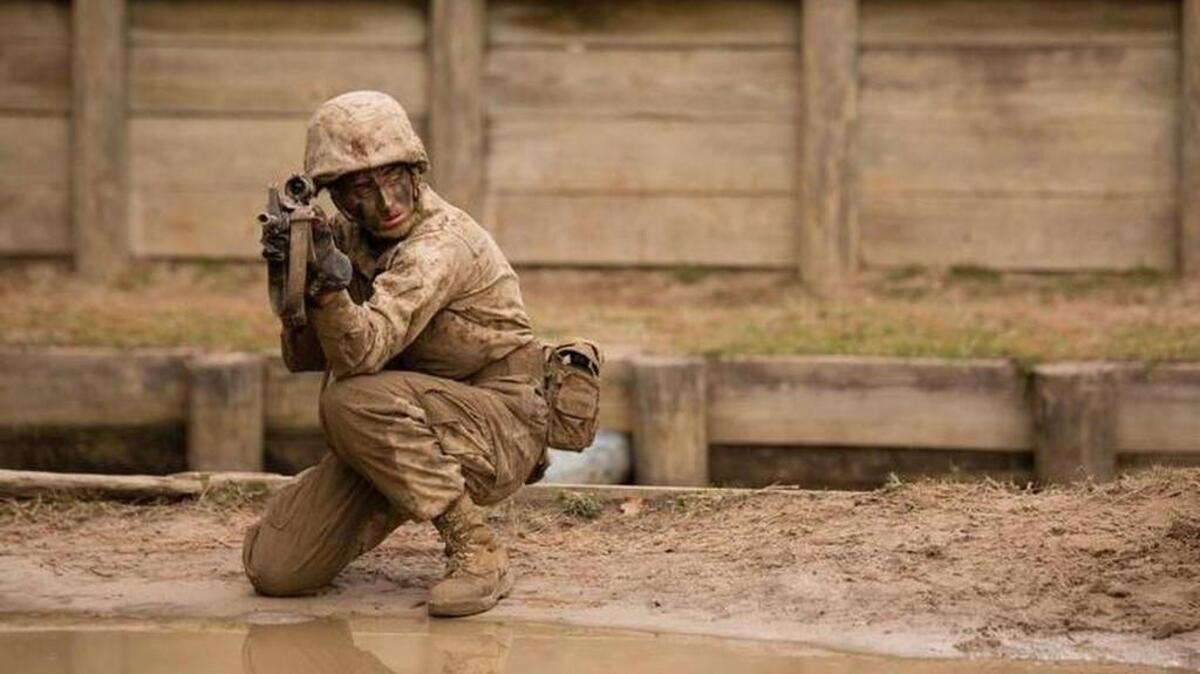 Pfc. Maria Daume, a Marine recruit at the time of this photo, is pictured performing a combat exercise during the Crucible, the final test to become a Marine at Marine Corps Recruit Depot Parris Island, earlier this year.