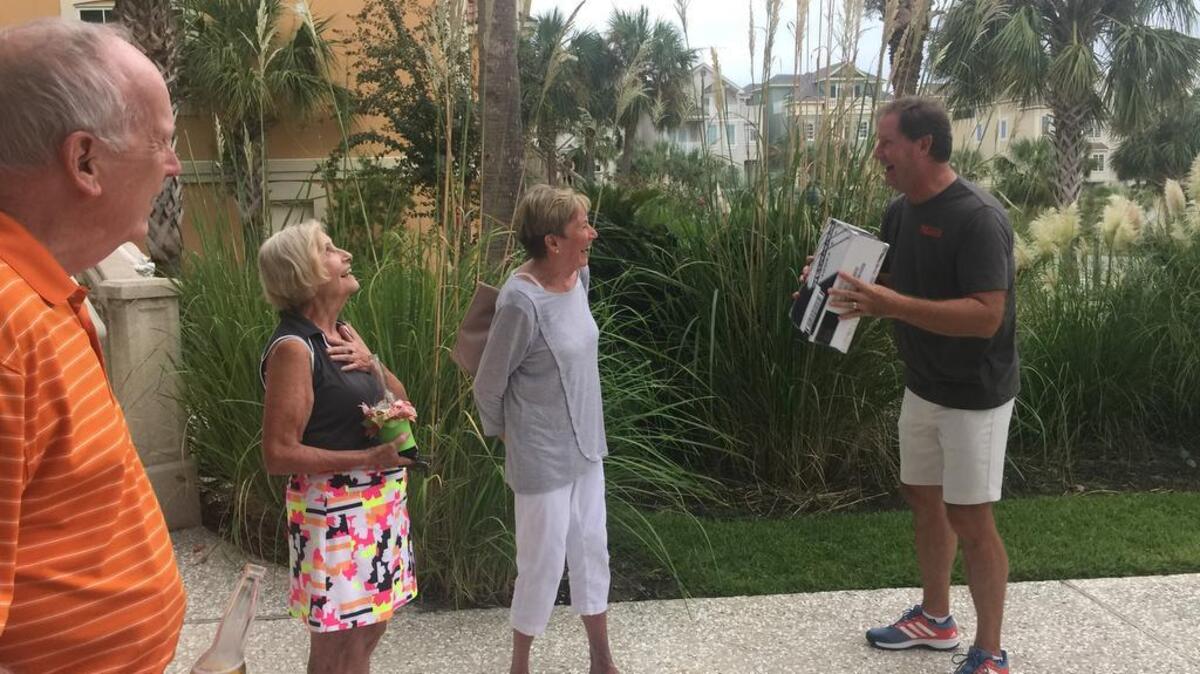 Ted Wallhaus, right, laughs as he goes to use his homemade viewfinder at the home of Linda and Al Vingelen on Hilton Head Island. Also pictured are Bob Wallhaus, Jan Powell and Penny Wallhaus.