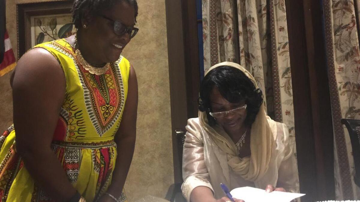 Mildred Muhammad, ex-wife of the D.C. sniper, signs a copy of her memoir “I’m Still Standing: Coming Out of the Darkness into the Light,” for Tangela Calhoun of Beaufort on Friday, April 28, 2017, at Hampton Hall in Bluffton. She spoke at “An Evening with Hopeful Horizons,” a fundraiser for a local group that serves victims of child abuse, sexual assault and domestic violence.