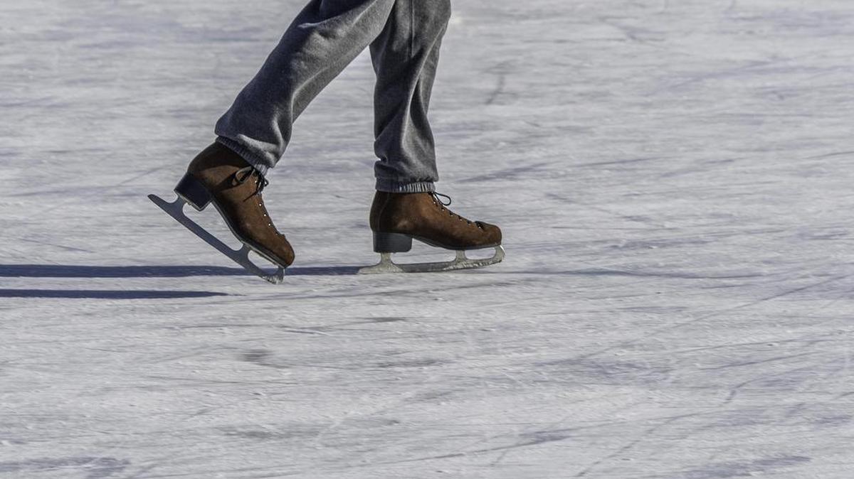 This man is skating on refrigerated ice. It will hurt when he falls.