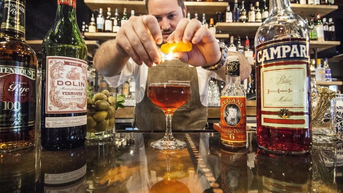 Clayton Rollison, chef/owner of Lucky Rooster on Hilton Head Island, prepares a cocktail.