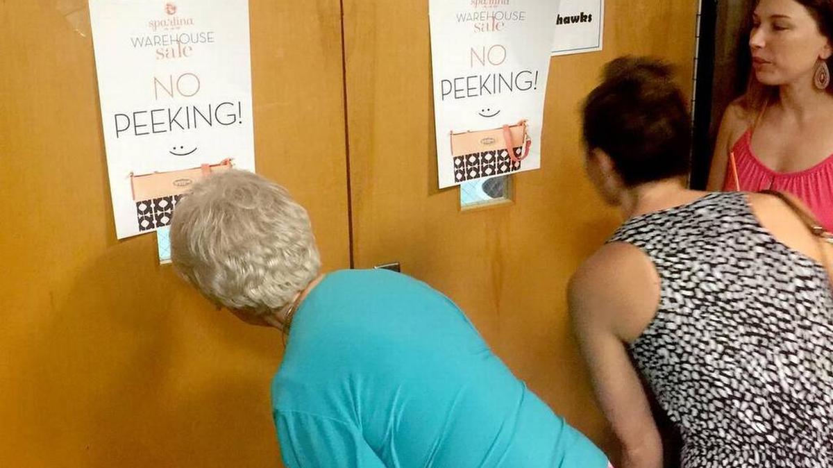 Waiting customers blatantly disregard a sign that was just asking to be ignored anyway at 2016’s fourth annual Spartina 449 warehouse sale at Hilton Head Island High School.