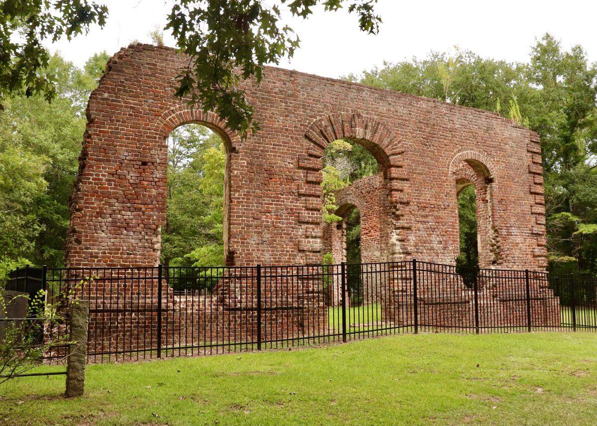 Burnt church: the ruins of Biggin Church stand silent among moss-covered trees and ancient gravestones. The parish church for St. Johns Berkeley, the church was built in 1761 to replace a wooden structure dating back to 1711. During the American Revolution, Biggin Church was used as a depot and outpost of the British – who burned the building in their retreat from Generals Francis Marion and Thomas Sumter during the long hot summer of 1781.