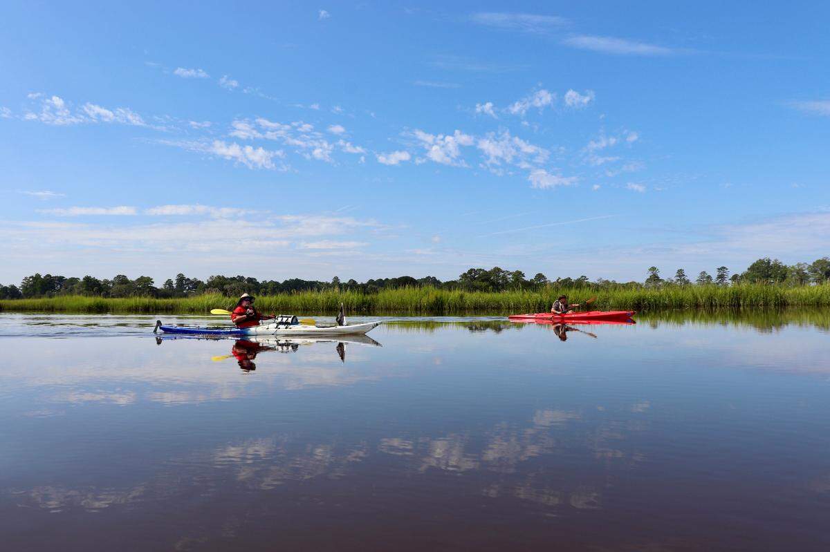 Another day in paradise: kayakers Tim Brown of Savannah and Scott Hanson of Seabrook paddle scenic Wimbee Creek on a circumnavigation of Williman Island in Northern Beaufort County.