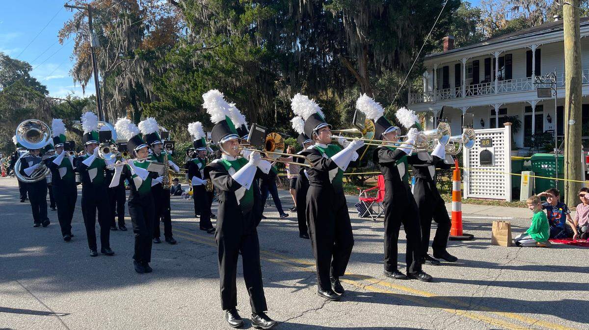 Hundreds of people lined the streets of Old Town Saturday morning to watch the town of Bluffton’s 50th Annual Christmas Parade. The parade, which started at 10 a.m. at town hall, traveled through Calhoun Street and May River Road before ending at Red Cedar Elementary. Residents watched and cheered as old-time cars, high school bands and local charities waved and handed out candy. Even the Grinch made an appearance. In this photo, Bluffton High School’s Marching Bobcats played a tune along Calhoun Street.