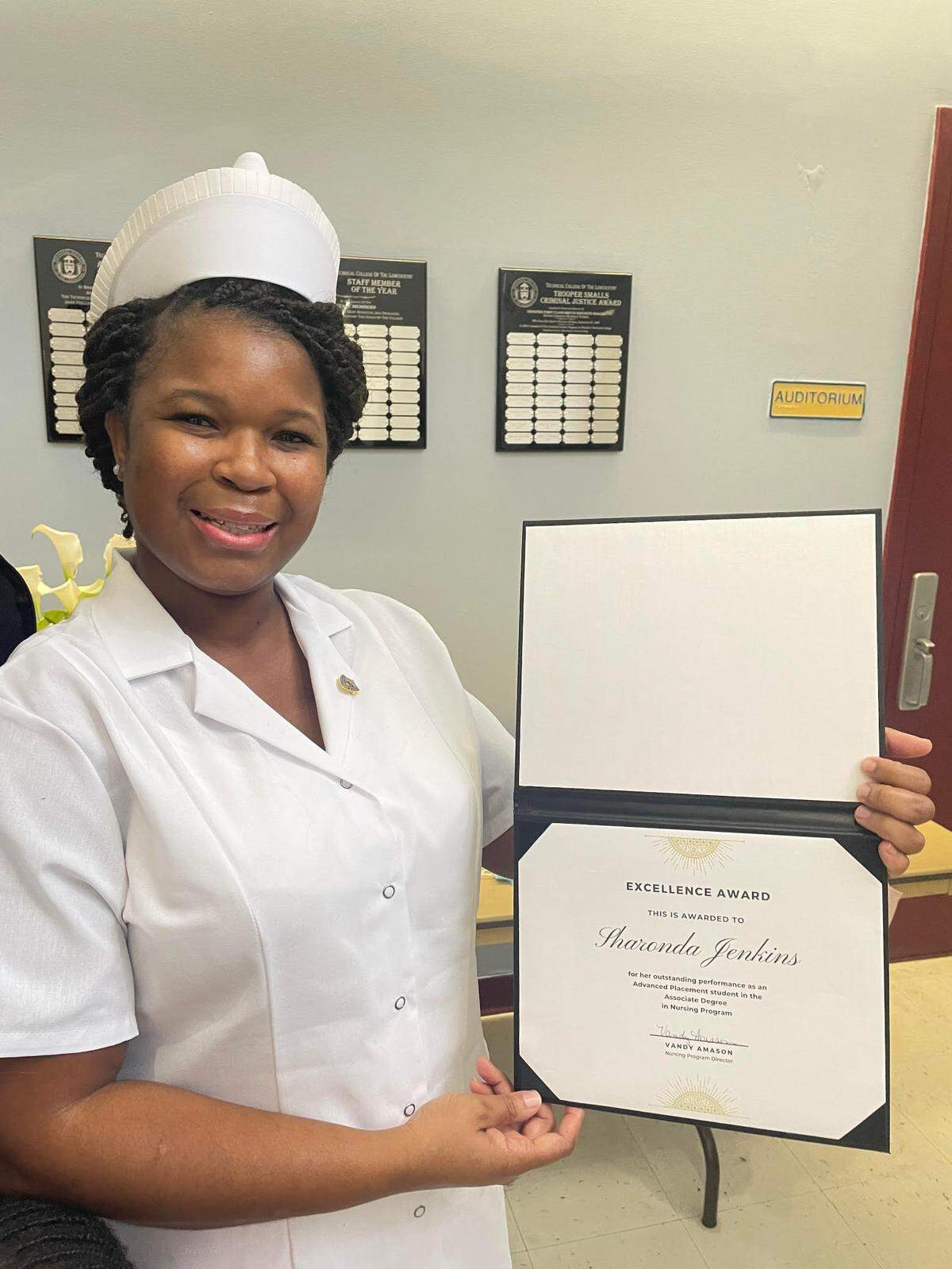 Sharonda Jenkins with the Excellence Award she won at the Technical College of the Lowcountry Pinning Ceremony Dec. 10 in Beaufort.