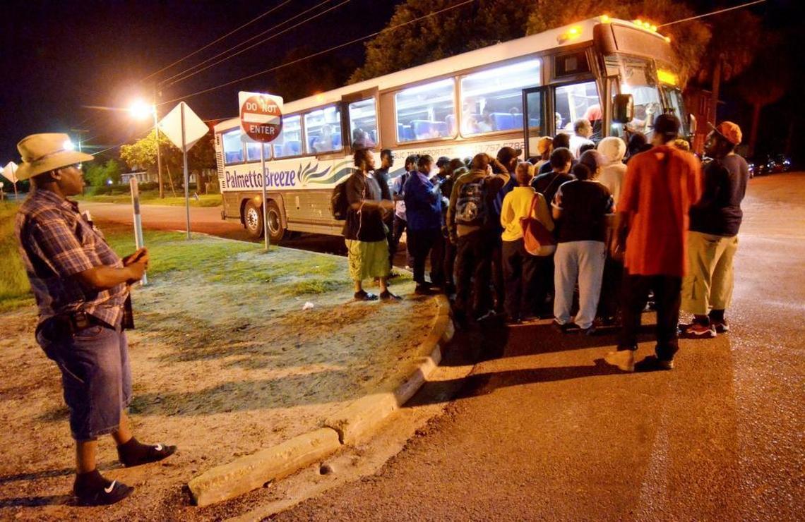 Riders in Allendale line up to board a Palmetto Breeze bus on a recent Wednesday. Many will spend about five hours on buses this day, getting to and from jobs on Hilton Head Island.