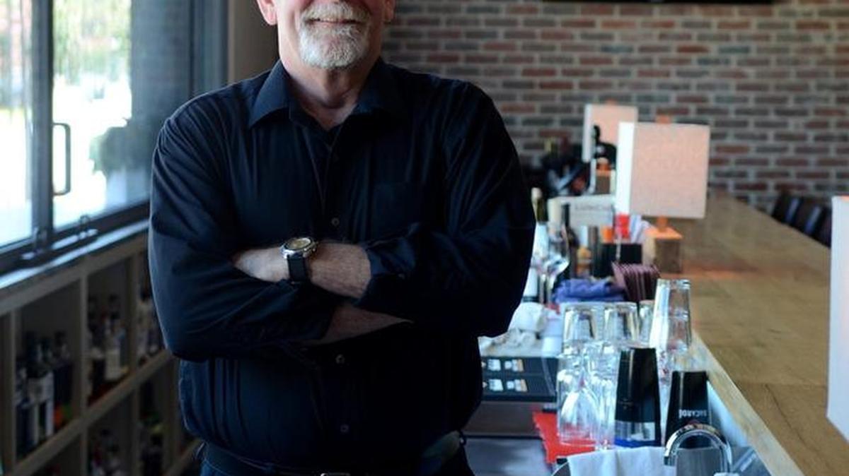 Bob Wilson, a bartender at The Bluffton Room, stands for a portrait behind the bar at the restaurant on August 12 in Bluffton.