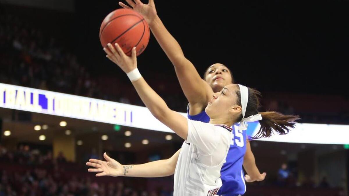 South Carolina’s Bianca Cuevas-Moore shoots under Kentucky’s Alyssa Rice.