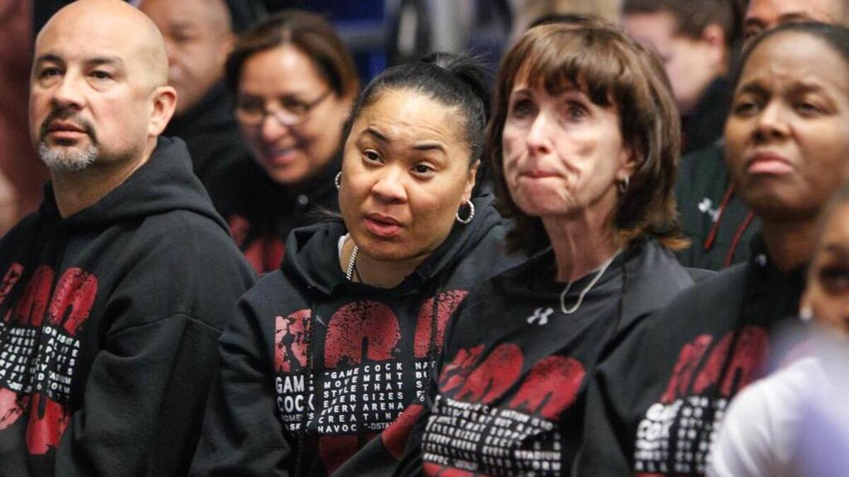 South Carolina coaches Fred Chmiel, Dawn Staley, Lisa Boyer and Nikki McCray-Penson watch just before USC is selected to the Stockton (Calif.) region of the NCAA tournament.